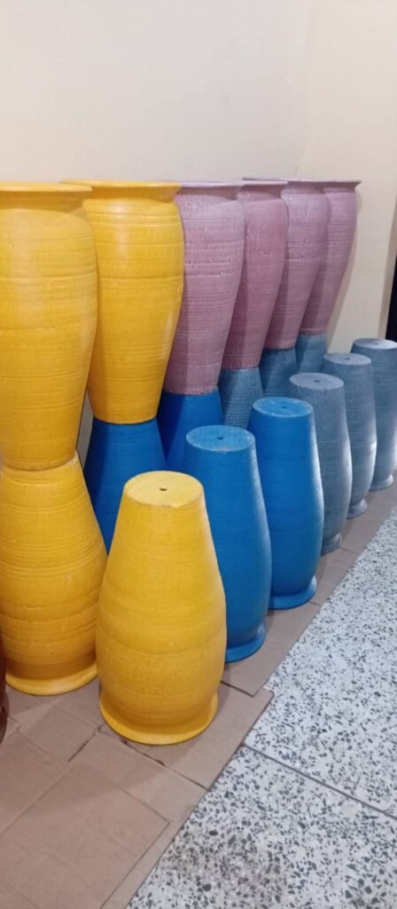 Tall ribbed floor vases in yellow, blue, mauve and grey