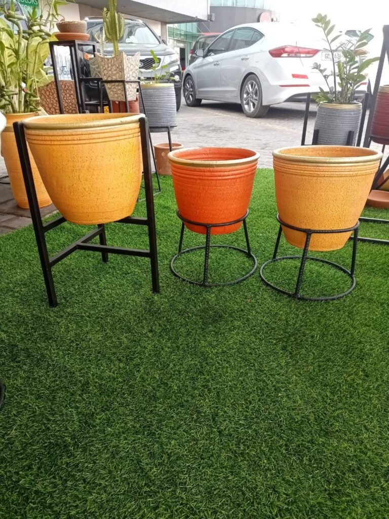 Textured gold-rim pots in mustard yellow and terracotta orange